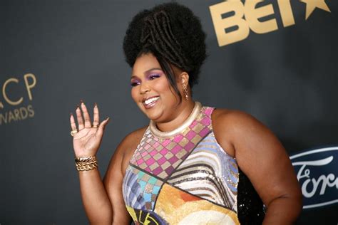 celebrities and gucci hairband|Lizzo's Bantu Knots and Bedazzled Gucci Barrette .